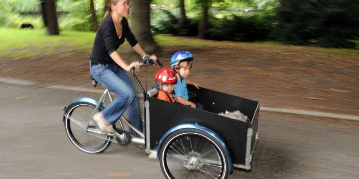 Four wheels bad, but three sehr gut. Germans climb aboard cargo bikes.